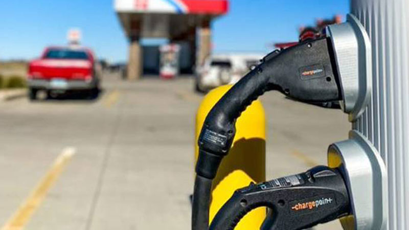 EV charge at a gas station.